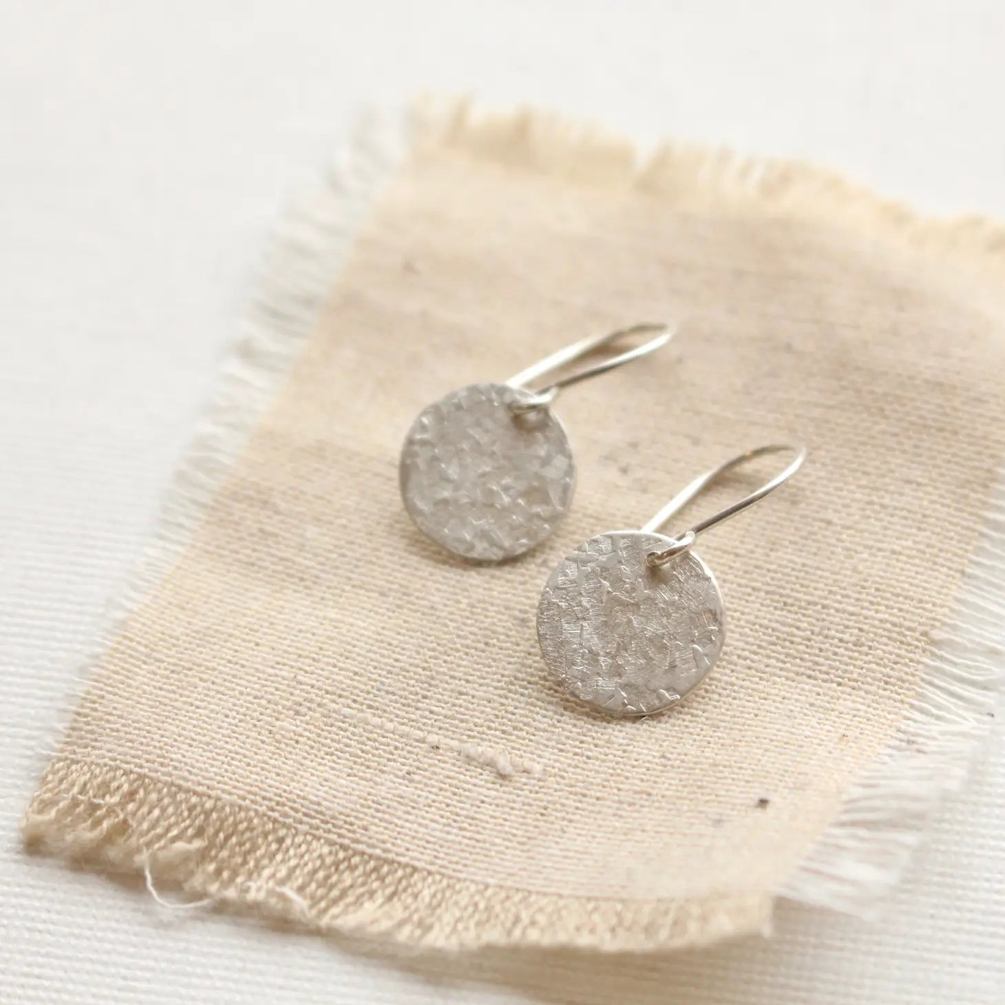 Hoop earrings with intricate designs for a unique and artistic appearance-Textured Silver Disc Earrings